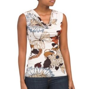 Gorgeous top. Flattering fit